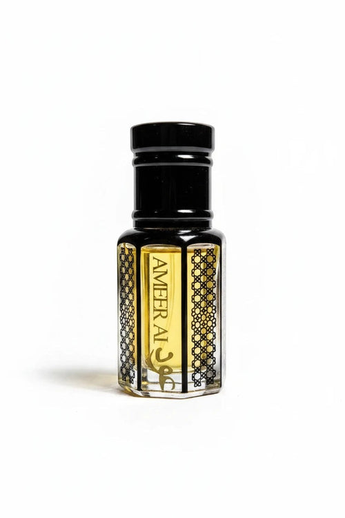 fragume Ameer Al Oud concentrated perfume oil in a decorative glass bottle with black geometric patterns