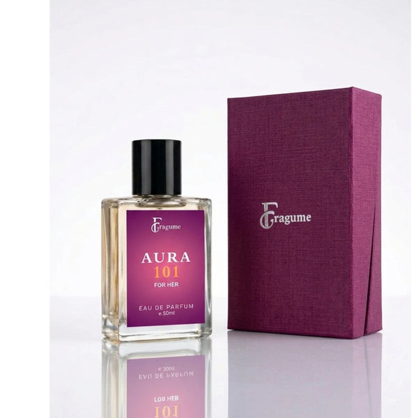 fragume Aura 101 Eau De Parfum in a minimalist glass bottle next to a textured deep purple gift box on white surface