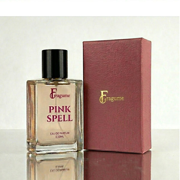 fragume Pink Spell Eau De Parfum in a minimalist glass bottle with a textured dark pink presentation box