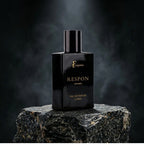 fragume Respon Eau De Parfum for men in a sleek black glass bottle with gold lettering displayed on a dark stone